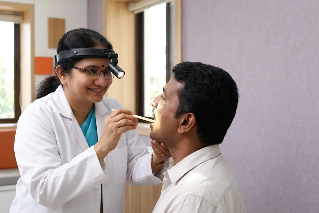 Dr. A. Sudha performing a throat examination at THANC Hospital, Chennai
