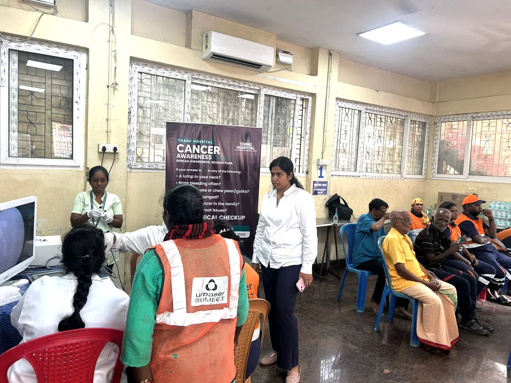 Corporation sanitary workers waiting for cancer screening at THANC camp